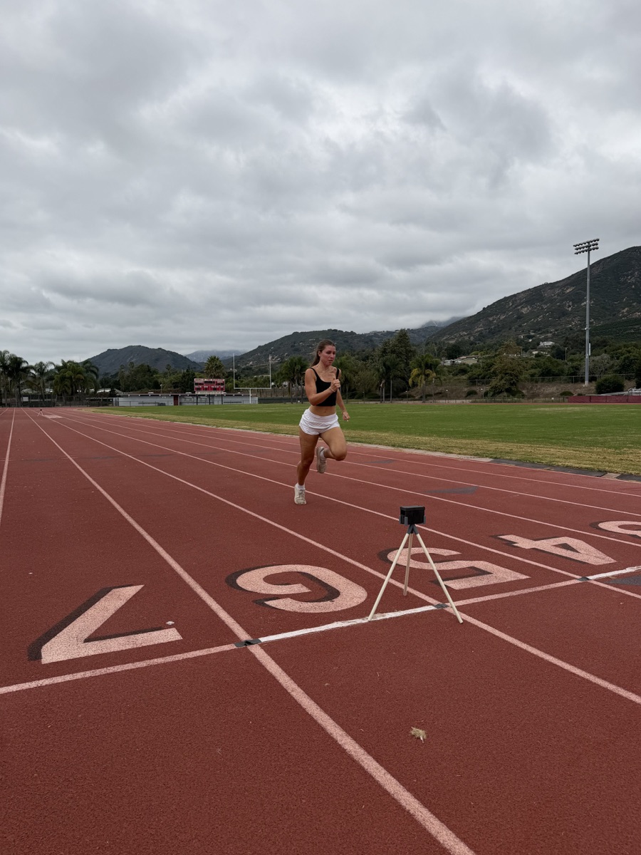 A Carpinteria High athlete running toward an EqualSplit timing gate