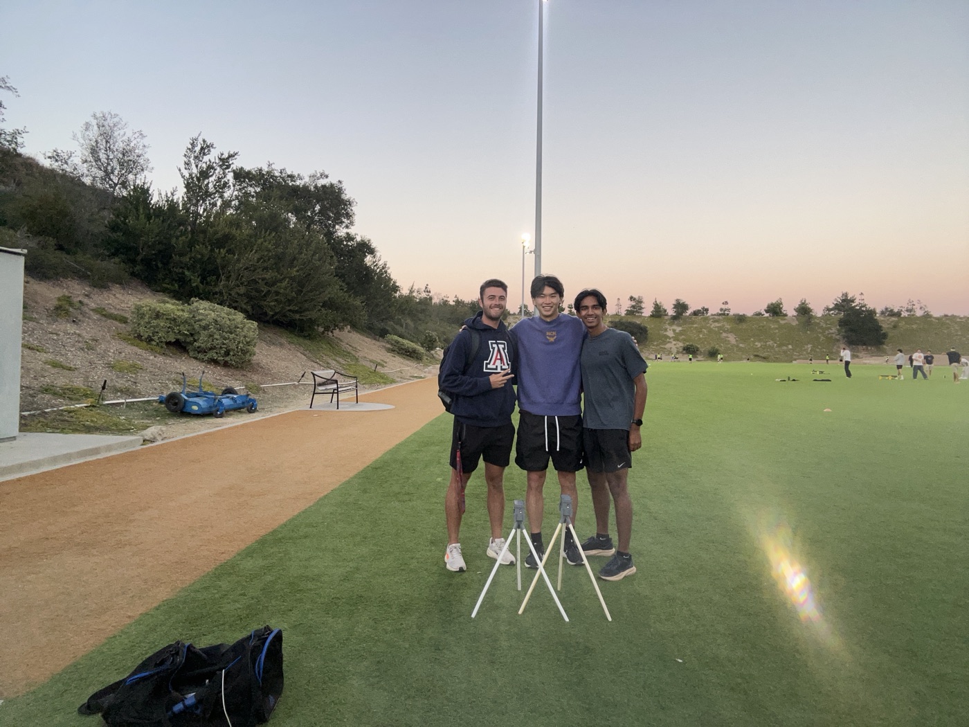 Louis and Jayden with coach Nathan Farhit after a side-by-side timing session