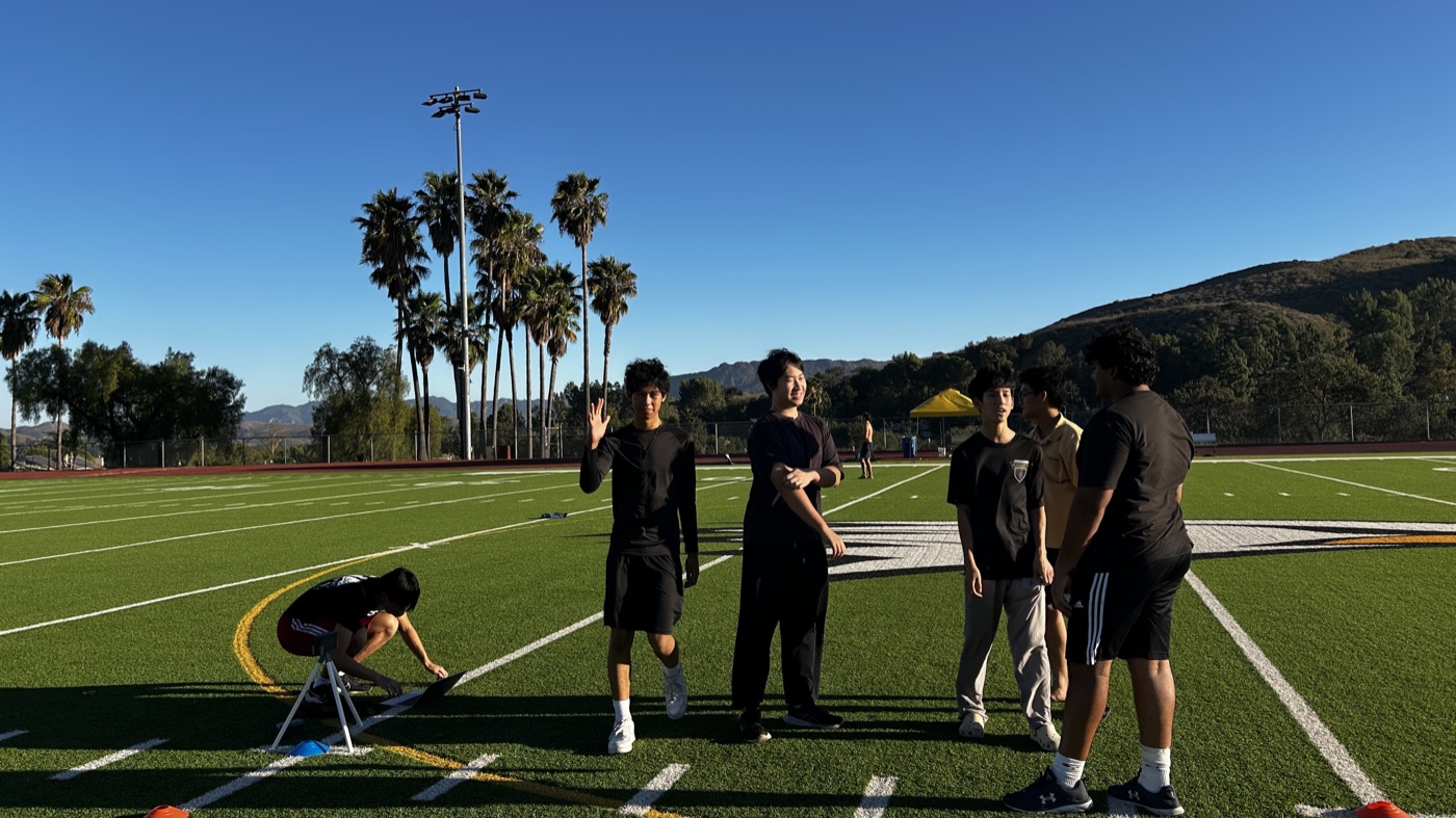 Athletes on the field while an EqualSplit gate is set up
